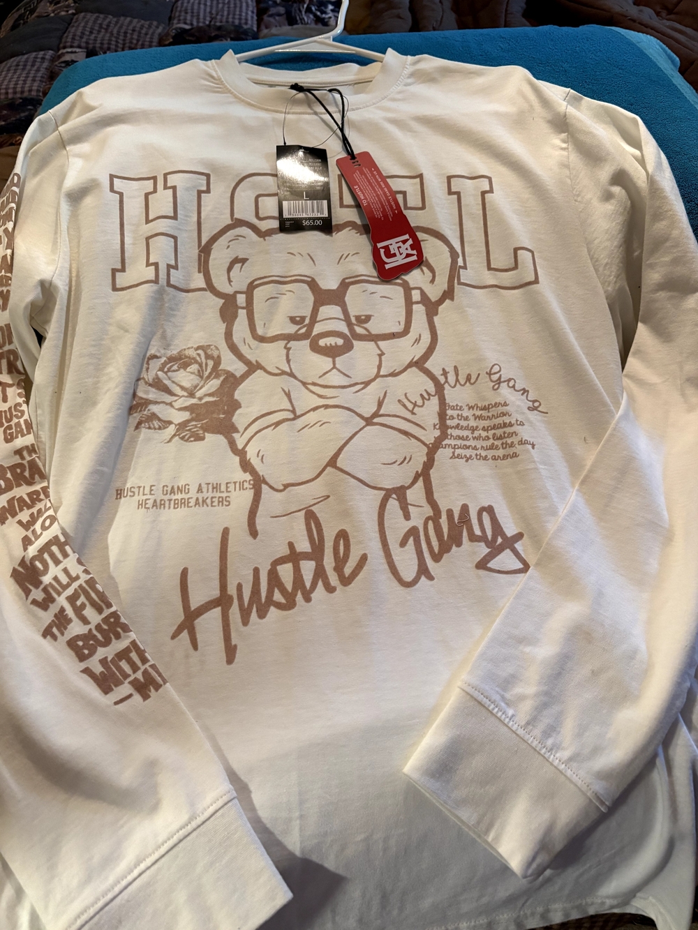 Hustle Gang Cream Long Sleeve Tee with Tan Graphic and Red Tag